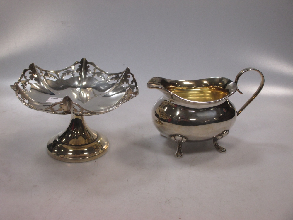 A silver sauce boat and silver pierced bon-bon dish. (2)