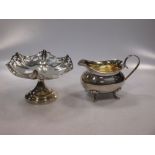 A silver sauce boat and silver pierced bon-bon dish. (2)