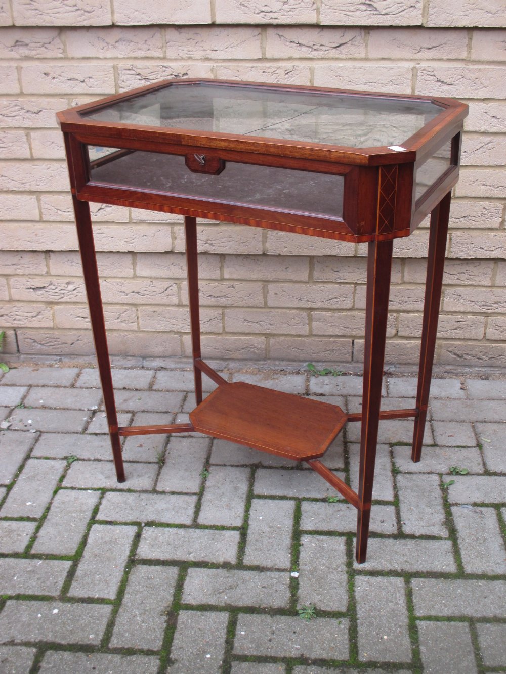 A glass top display (bijouterie) table, 77cm high x 62cm wide