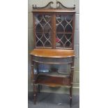 An Edwardian mahogany display cabinet with blind fret decoration, and two glazed doors above,