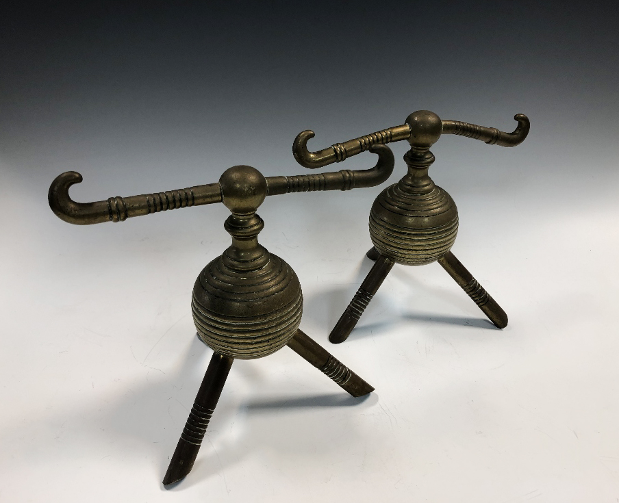 Attributed to Dr. Christopher Dresser for Benham & Froud, a pair of brass andirons, the ribbed