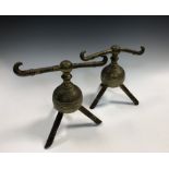 Attributed to Dr. Christopher Dresser for Benham & Froud, a pair of brass andirons, the ribbed