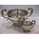 An Edward VII silver two-handled bowl by Walker & Hall, Sheffield, 1905, with scrolling handles,
