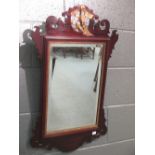 A George III mahogany fret framed wall mirror with Ho Ho bird cresting