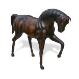A large leather clad model of a horse, modelled with one foreleg raised 91 x 115cm (35 x 45in)