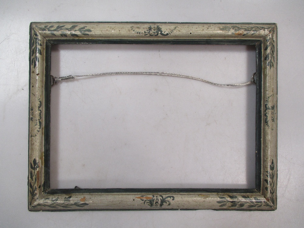 An Italian 19th Century polychrome moulding frame with leaf decoration to corners, sight size 19 x