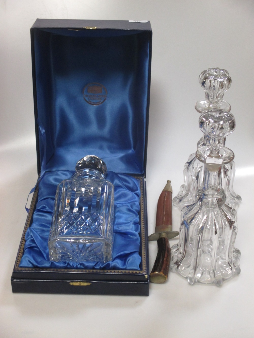 A pair of early 20th century glass decanters and a modern Thomas Webb decanter and a souvenir