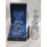 A pair of early 20th century glass decanters and a modern Thomas Webb decanter and a souvenir