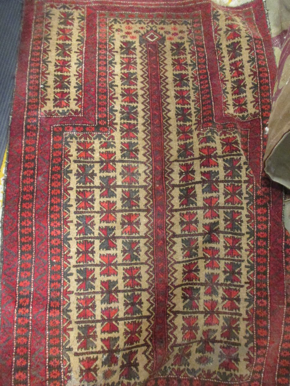 Five tribal rugs including a Belouchi prayer rug, and a Causcasian rug (5)