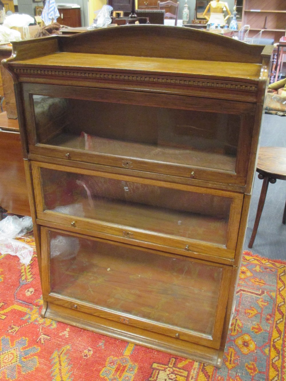 A Globe Wernicke type three section stacking bookcase, 126cm high, 80cm wide