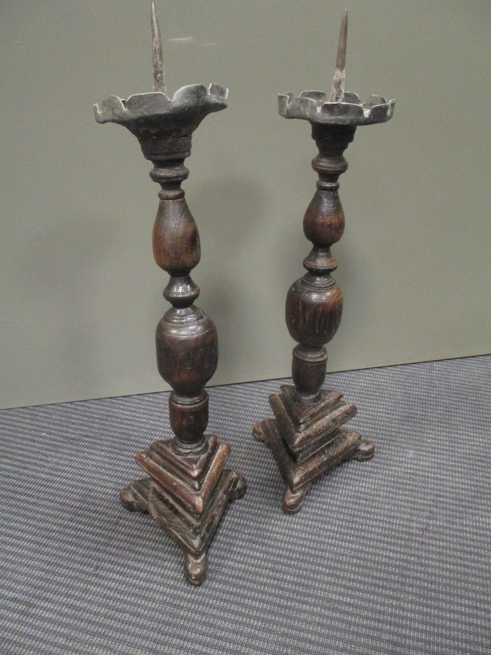 A pair of wooden altar candle sticks (2)