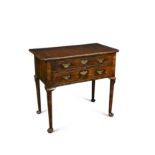 An 18th century walnut lowboy,