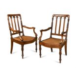 A pair of 19th century colonial padouk rail back armchairs,