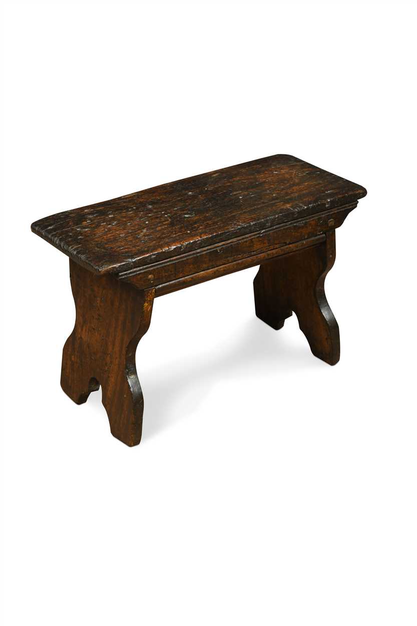 A 18th Century oak boarded stool,