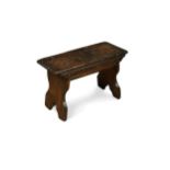 A 18th Century oak boarded stool,