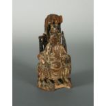 A Chinese carved wood figure of Guanyin, Qing Dynasty, late 17/18th century,
