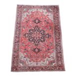 An Herez red ground rug,