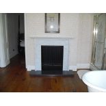 A 19th Century variegated Carrera white marble fireplace,