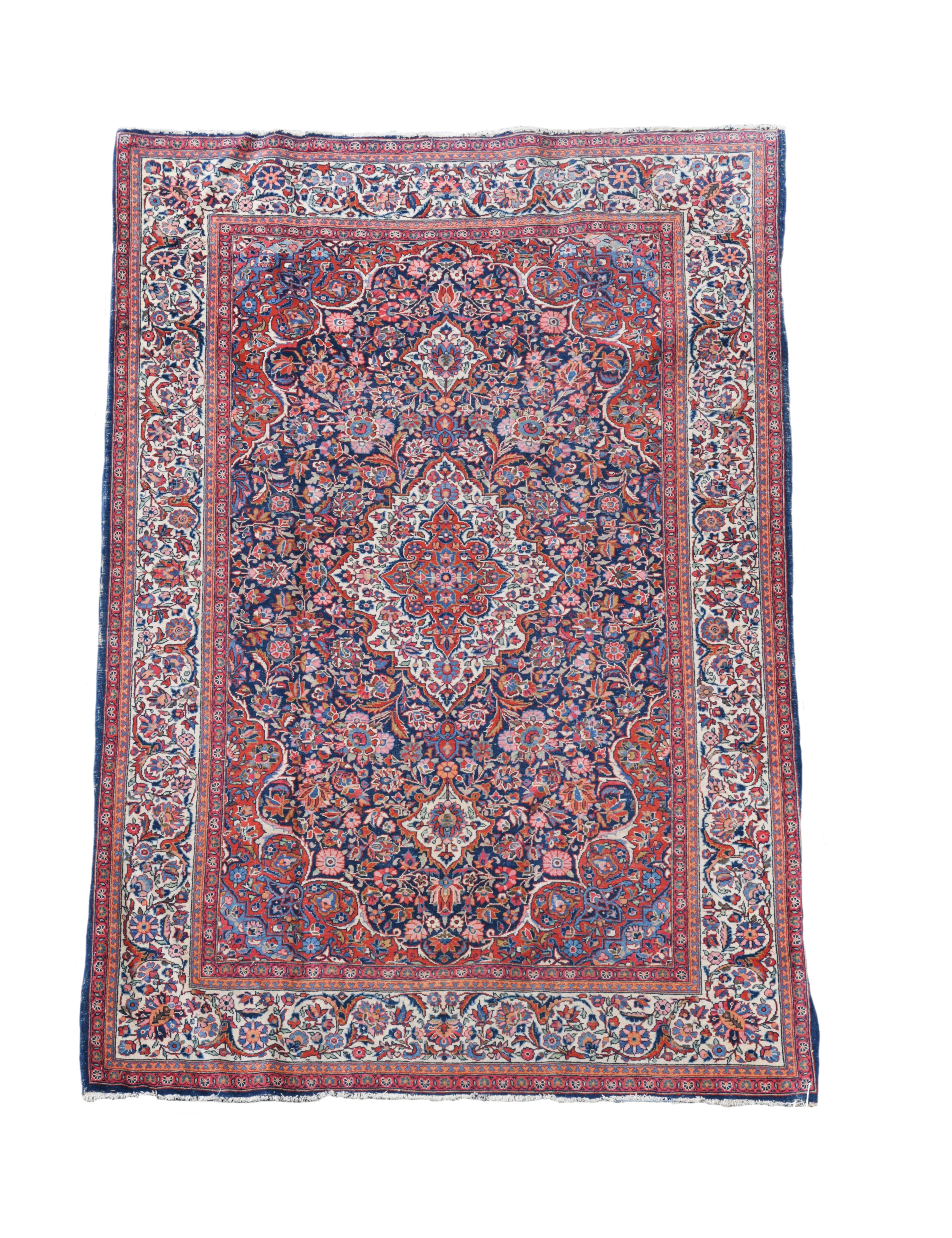 A Kashan blue ground rug,