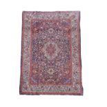A Kashan blue ground rug,