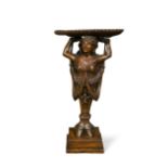 A 19th century Continental carved walnut pedestal waiter,