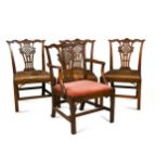 A George III Chinese Chippendale carved mahogany elbow dining chair,