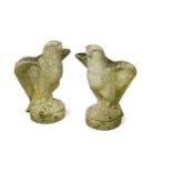 A pair of composition stone gate pillar finials of standing eagles