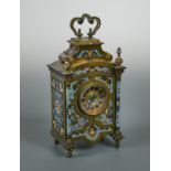 A late 19th century French Champlevee enamel bronze mantle clock,