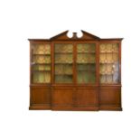A George III mahogany breakfront library bookcase,