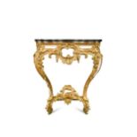 A George IV carved and pierced gilt-wood serpentine console in the manner of Thomas Johnson,