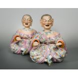 A pair of 19th century German porcelain nodding head pagoda figures,