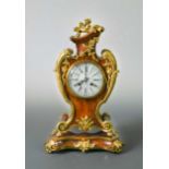 A French tortoiseshell and ormolu mounted mantel clock,