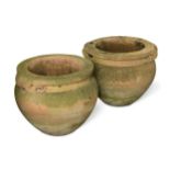 A set of four modern composite stone garden urns in the manner of Gertrude Jekyll,