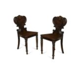 A pair of Regency mahogany hall chairs,