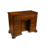 A George III mahogany kneehole desk,