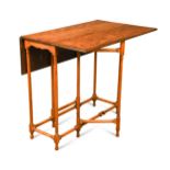 A George III satinwood spider leg table,