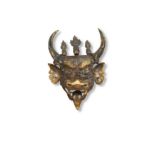 A Tibetan bronze mask of Dharmapala Yamantaka,