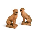 A pair of 20th century terracotta garden figures of seated Lion Dogs,