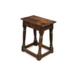 A 17th Century oak coffin stool,
