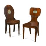 A Regency mahogany hall chair with painted crest,