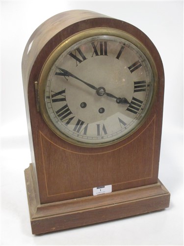 A mahogany dome top chiming clock