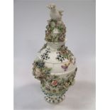 A Bow encrusted porcelain vase and cover