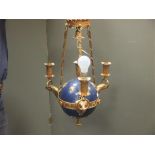 A blue painted and gilt metal orb ceiling light