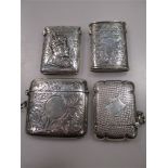 Four silver vesta cases including one with unusual sliding interior and one featuring an image of