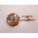 Two sweetheart brooches together with a locket brooch, the first for the RAF, stamped '9ct', the