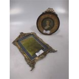 An Edwardian enamelled & brass photo frame & another.