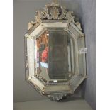 A Venetian wall mirror, engraved with marginal plates with pierced cresting, 116cm high