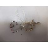 Tow 9ct gold diamond set heart pendants