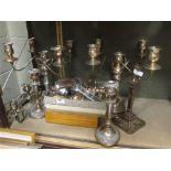 A pair of Sheffield plate candelabrum (A/F) other plated candlesticks, a pair of plated shell butter