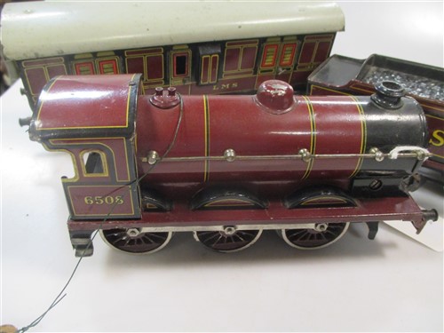 A Bing 0 gauge long distance loco 0-60 with tender and three matching coaches